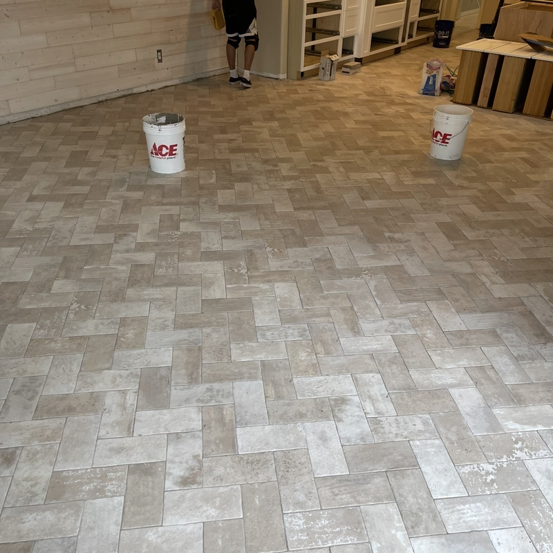 Herringbone tile flooring installation
